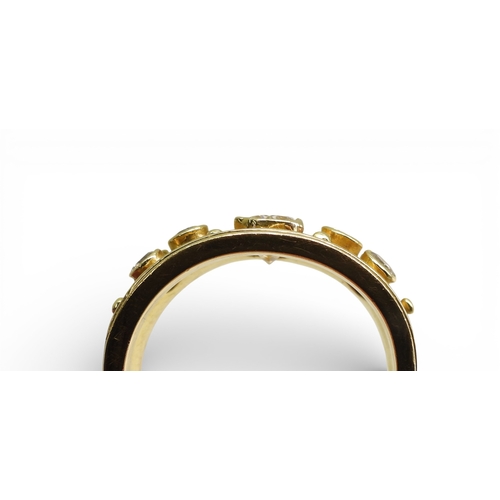 2738 - A DIAMOND SET WIDE BAND RINGthe 18ct gold mount is set with an oblong princess cut diamond of estima... 