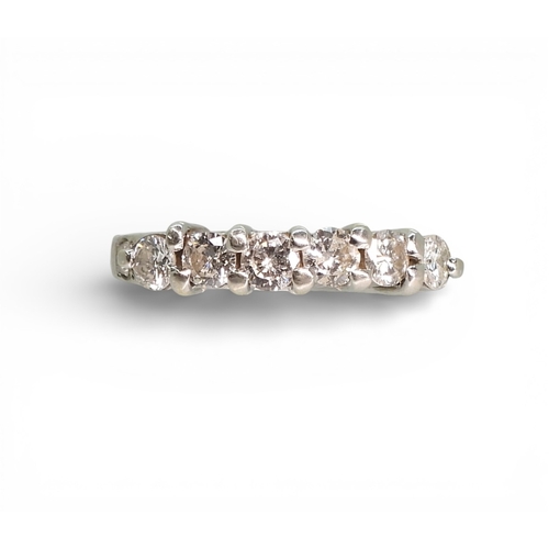 2739 - A SIX STONE DIAMOND RINGthe white metal mount, set with estimated approx 0.78cts of brilliant cut di... 