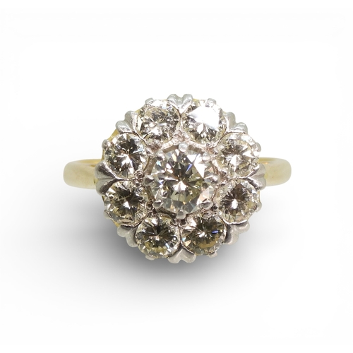 2740 - A DIAMOND FLOWER RINGthe 18ct gold and platinum galleried mount is set with estimated approx 1.70cts... 