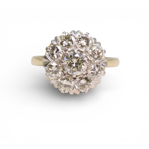 2740 - A DIAMOND FLOWER RINGthe 18ct gold and platinum galleried mount is set with estimated approx 1.70cts... 