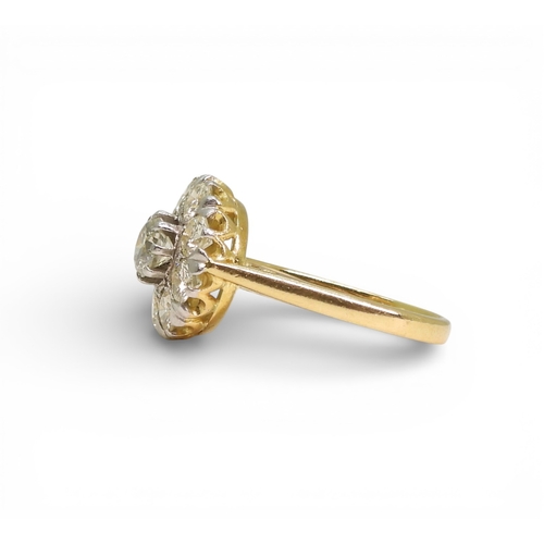 2740 - A DIAMOND FLOWER RINGthe 18ct gold and platinum galleried mount is set with estimated approx 1.70cts... 