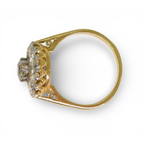 2740 - A DIAMOND FLOWER RINGthe 18ct gold and platinum galleried mount is set with estimated approx 1.70cts... 
