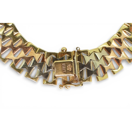 2741 - AN ITALIAN MADE 9CT GOLD TRICOLOUR BRACELETof double tapered form with bark textured links. Length19... 