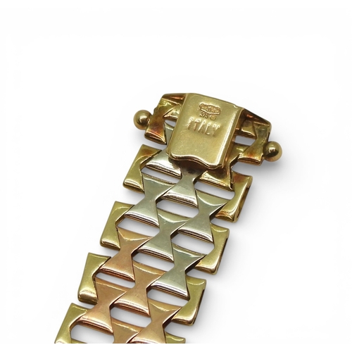 2741 - AN ITALIAN MADE 9CT GOLD TRICOLOUR BRACELETof double tapered form with bark textured links. Length19... 