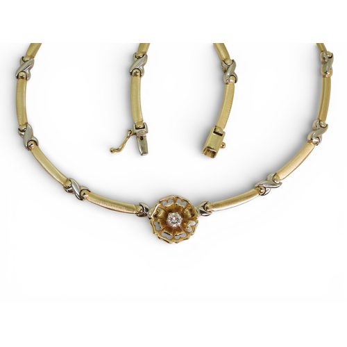 2745 - A DIAMOND FLOWER NECKLACEmade in 14k yellow and white gold with baton and kiss shaped links, with a ... 