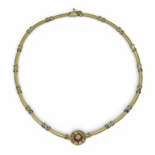 2745 - A DIAMOND FLOWER NECKLACEmade in 14k yellow and white gold with baton and kiss shaped links, with a ... 