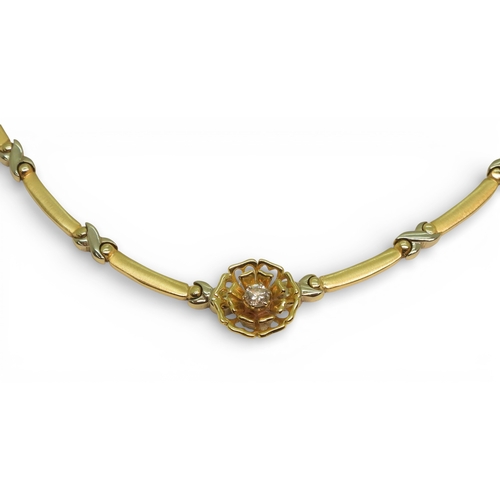 2745 - A DIAMOND FLOWER NECKLACEmade in 14k yellow and white gold with baton and kiss shaped links, with a ... 