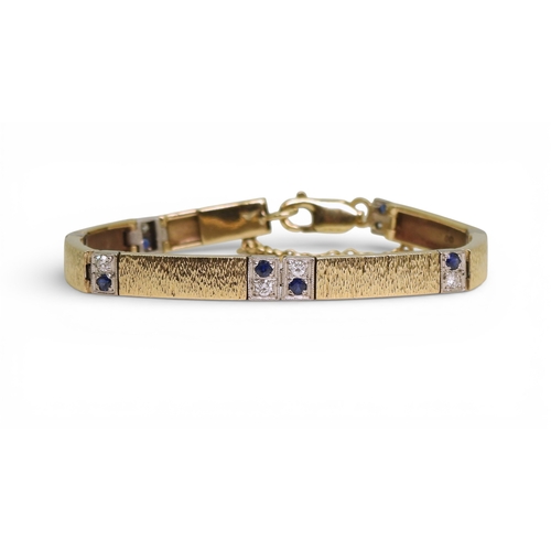 2746 - A 9CT GOLD SAPPHIRE & DIAMOND BRACELETmade by Alan Hodgkinson in Edinburgh, 1990, with bark text... 