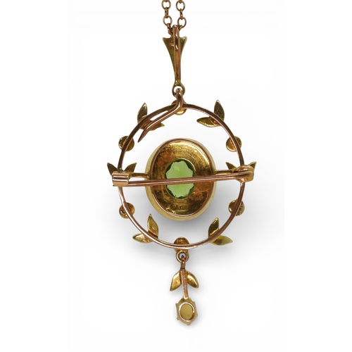 2747 - AN EDWARDIAN PENDANT BROOCHmade in 9ct gold set with a green gem and seed pearls, length with bail, ... 
