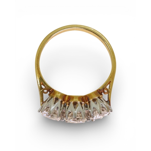 2749 - A THREE STONE DIAMOND RINGthe mount in 18ct yellow and white gold and set with three diamonds with a... 