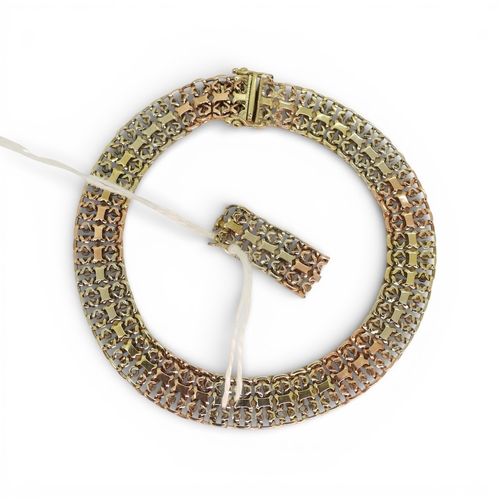 2750 - A 9CT TRICOLOUR GOLD BRACELETwith fancy lacey links, length 19.3cm, with box clasp and two safety cl... 