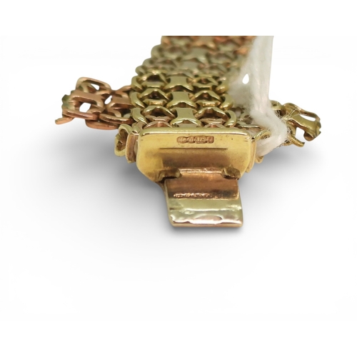 2750 - A 9CT TRICOLOUR GOLD BRACELETwith fancy lacey links, length 19.3cm, with box clasp and two safety cl... 