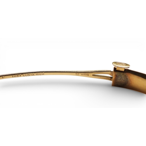 2751 - A CLASSIC PLAIN GOLD BANGLEmade in 14k gold, with gentle domed interior and exterior, the tongue of ... 