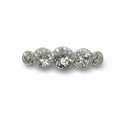 2722 - A FIVE STONE DIAMOND RINGset with five old cut diamonds, in a delicate bright white metal  mill-grai... 