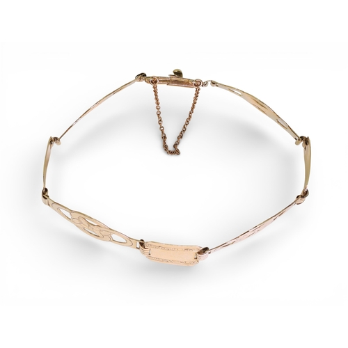 2752 - A FANCY LINK BRACELETmade in 9ct gold by Henry Griffith & Sons Ltd, circa 1952. the wide links o... 