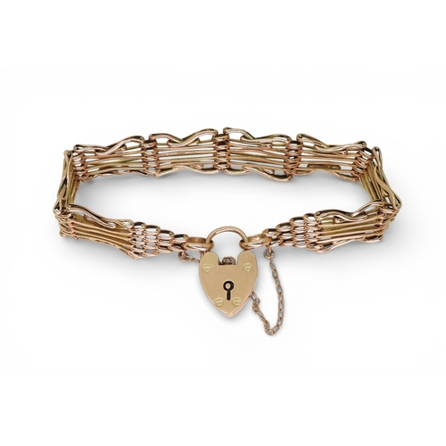 2753 - A FANCY GATE BRACELETmade in rose gold, with crossed links and a heart shaped clasp, length 19cm, we... 