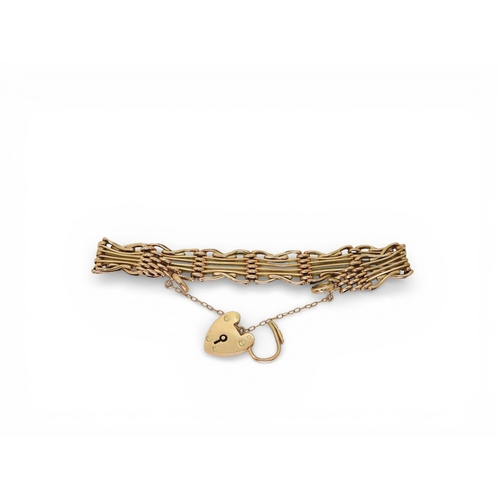 2753 - A FANCY GATE BRACELETmade in rose gold, with crossed links and a heart shaped clasp, length 19cm, we... 