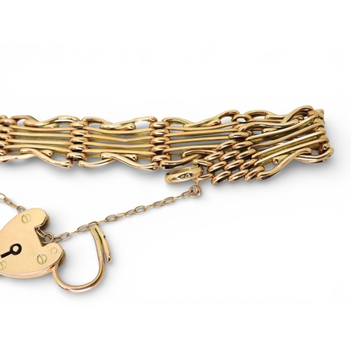 2753 - A FANCY GATE BRACELETmade in rose gold, with crossed links and a heart shaped clasp, length 19cm, we... 