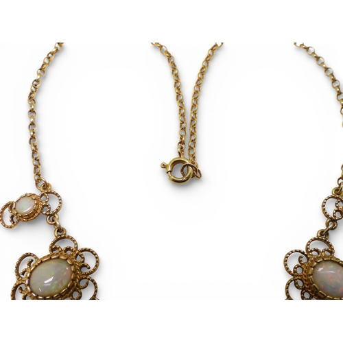 2758 - A WHITE OPAL NECKLACEmade by Bohemian Jewellery London (BJLd) in 1978. The 9ct gold filigree mounts ... 