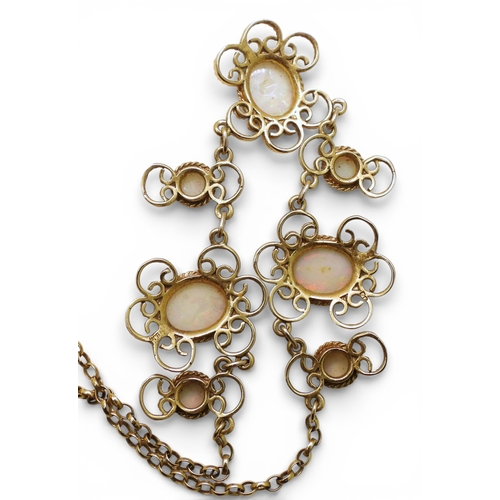 2758 - A WHITE OPAL NECKLACEmade by Bohemian Jewellery London (BJLd) in 1978. The 9ct gold filigree mounts ... 