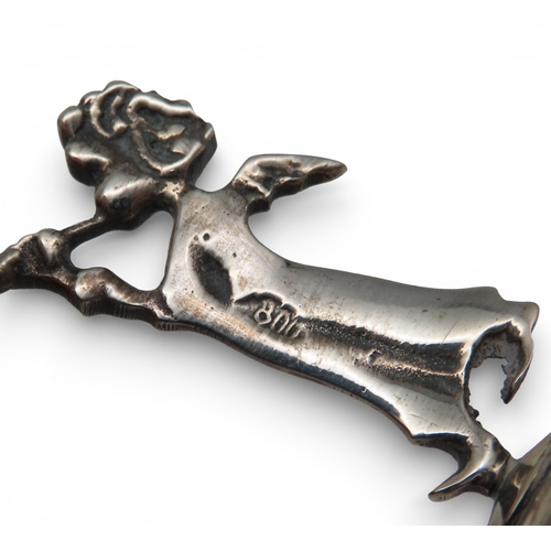 911 - A silver miniature photoframe, 800&nbsp; standard, and two cherub candlesticks, 800 standard, weigha... 