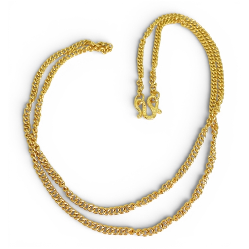 700 - A bright yellow metal curb chain with Chinese symbols to the clasp, length 46cm, weight 11.4gms