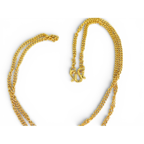700 - A bright yellow metal curb chain with Chinese symbols to the clasp, length 46cm, weight 11.4gms