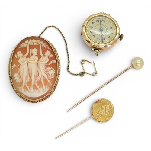 705 - An American 1 Dollar coin made into a lapel pin, weight 2gms, a 9ct cameo brooch and watch head, and... 