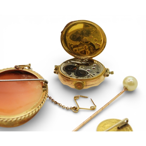 705 - An American 1 Dollar coin made into a lapel pin, weight 2gms, a 9ct cameo brooch and watch head, and... 