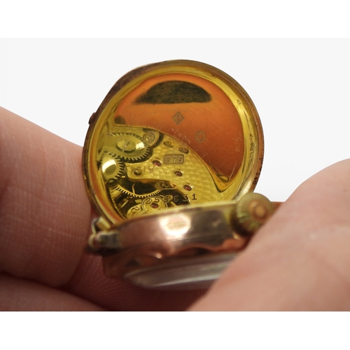705 - An American 1 Dollar coin made into a lapel pin, weight 2gms, a 9ct cameo brooch and watch head, and... 