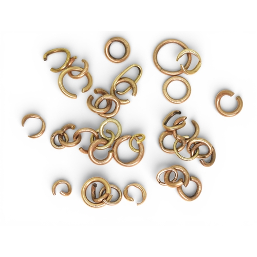 709 - A collection of yellow metal jump rings, weight 14.3gms