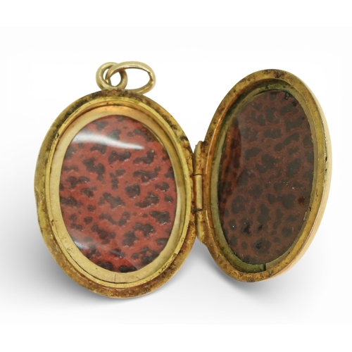 712 - A 9ct gold locket and a 9ct gold citrine and pearl brooch, weight combined 5.3gms