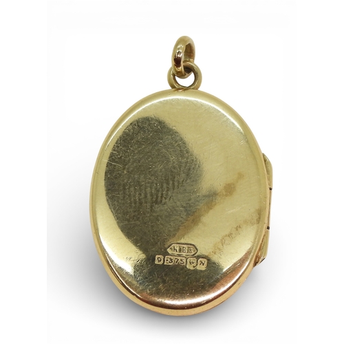 712 - A 9ct gold locket and a 9ct gold citrine and pearl brooch, weight combined 5.3gms