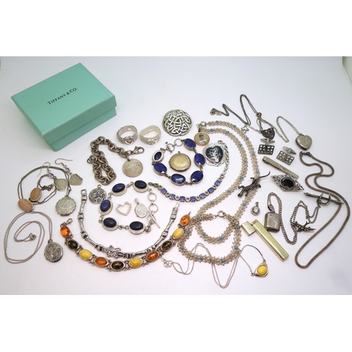 879 - A collection of silver and white metal jewellery to include bracelets set with lapis lazuli, and amb... 