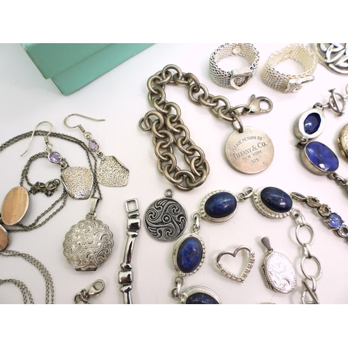 879 - A collection of silver and white metal jewellery to include bracelets set with lapis lazuli, and amb... 