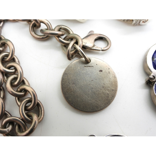 879 - A collection of silver and white metal jewellery to include bracelets set with lapis lazuli, and amb... 