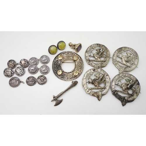 891 - A white metal Celtic knotwork brooch with zoomorphic design, set with citrines, a collection of simi... 