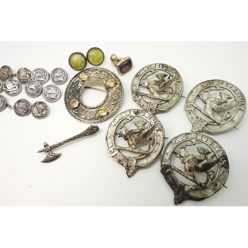 891 - A white metal Celtic knotwork brooch with zoomorphic design, set with citrines, a collection of simi... 