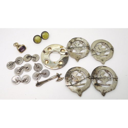 891 - A white metal Celtic knotwork brooch with zoomorphic design, set with citrines, a collection of simi... 