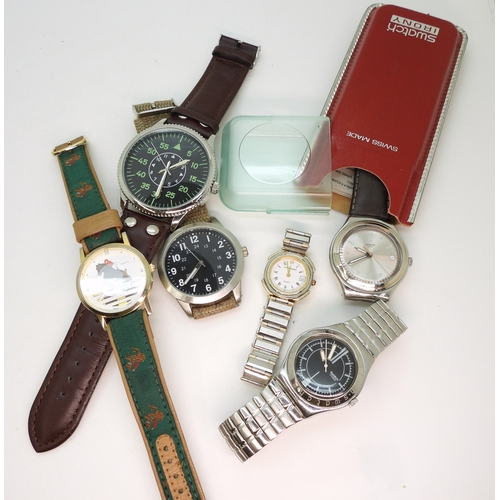 896 - A Swatch Irony in original box, a further Swatch watch with a black dial and further fashion watches... 