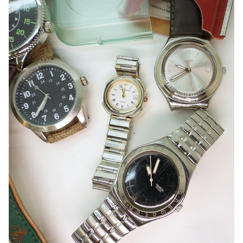 896 - A Swatch Irony in original box, a further Swatch watch with a black dial and further fashion watches... 