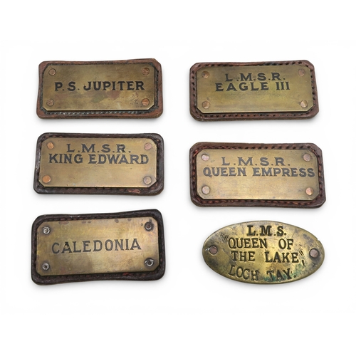 536 - A collection of early-20th century brass labels mounted on leather, believed originally to have been... 