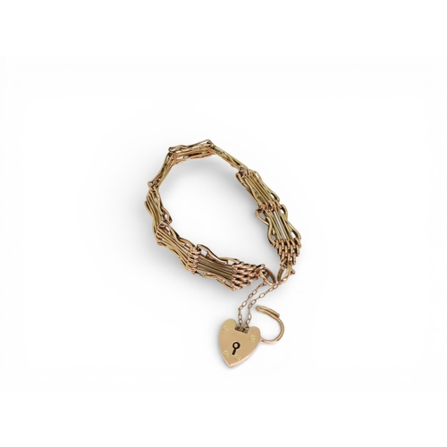 2753 - A FANCY GATE BRACELETmade in rose gold, with crossed links and a heart shaped clasp, length 19cm, we... 