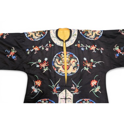 A CHINESE HAN STYLE LADIES SILK EMBROIDERED ROBEthe black ground ...
