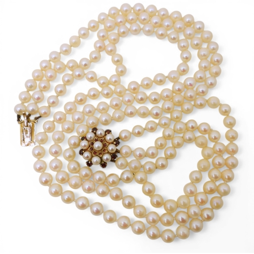 A TRIPLE STRING OF PEARLSwith a 9ct gold, pearl and garnet box clasp ...