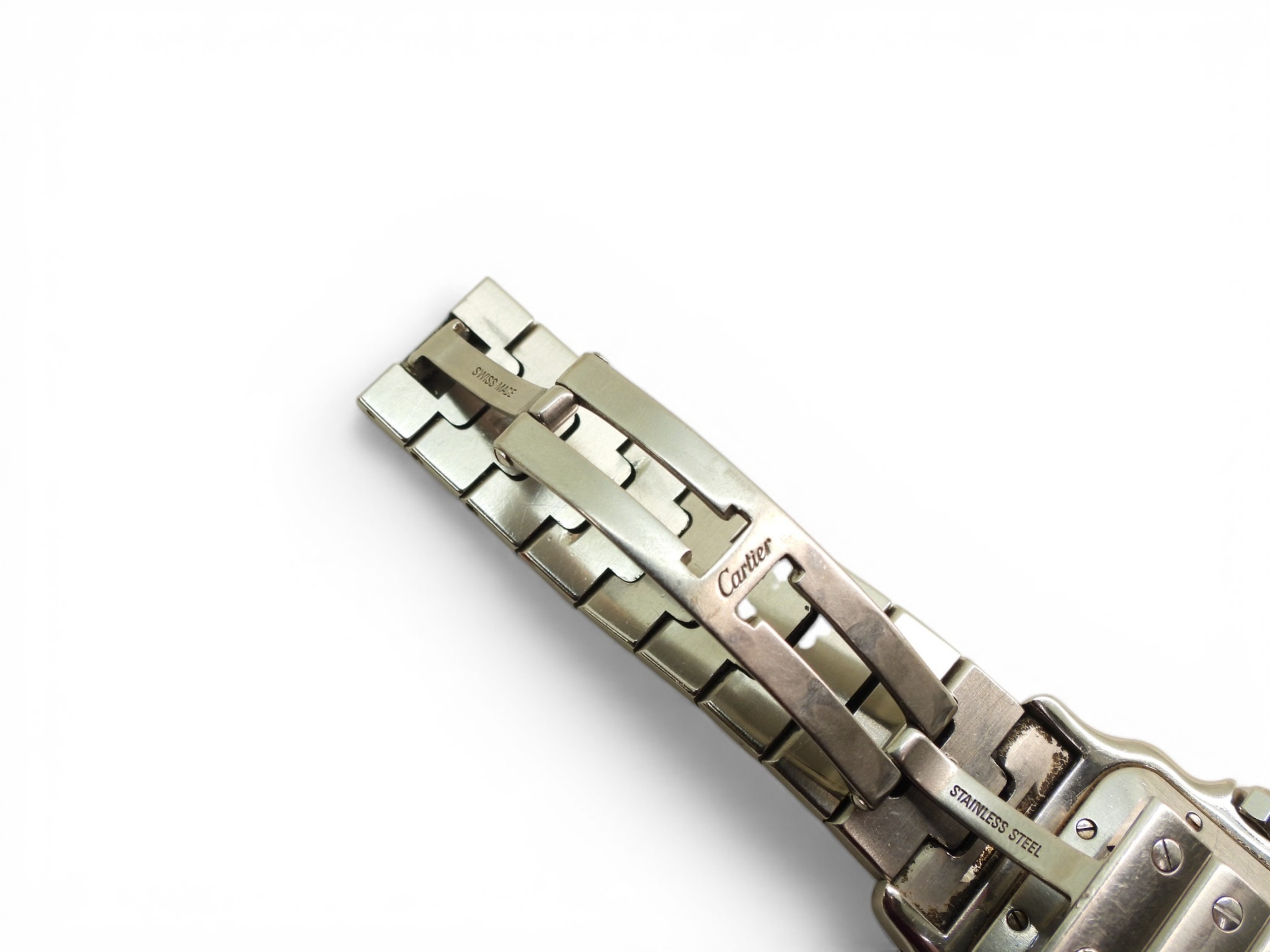 A CARTIER AUTOMATIC SANTOSmade in stainless steel with an engraved wave ...