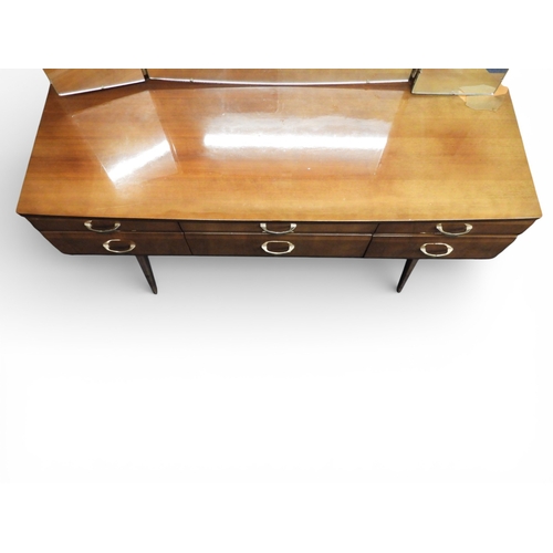 46 - A mid 20th century teak lacquer veneered three piece bedroom suite consisting chest of six drawers o... 