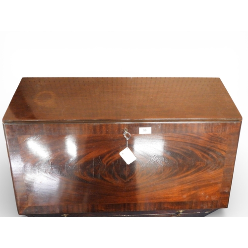 56 - A 20th century mahogany fall front writing bureau with three long drawers on cabriole supports, 102c... 