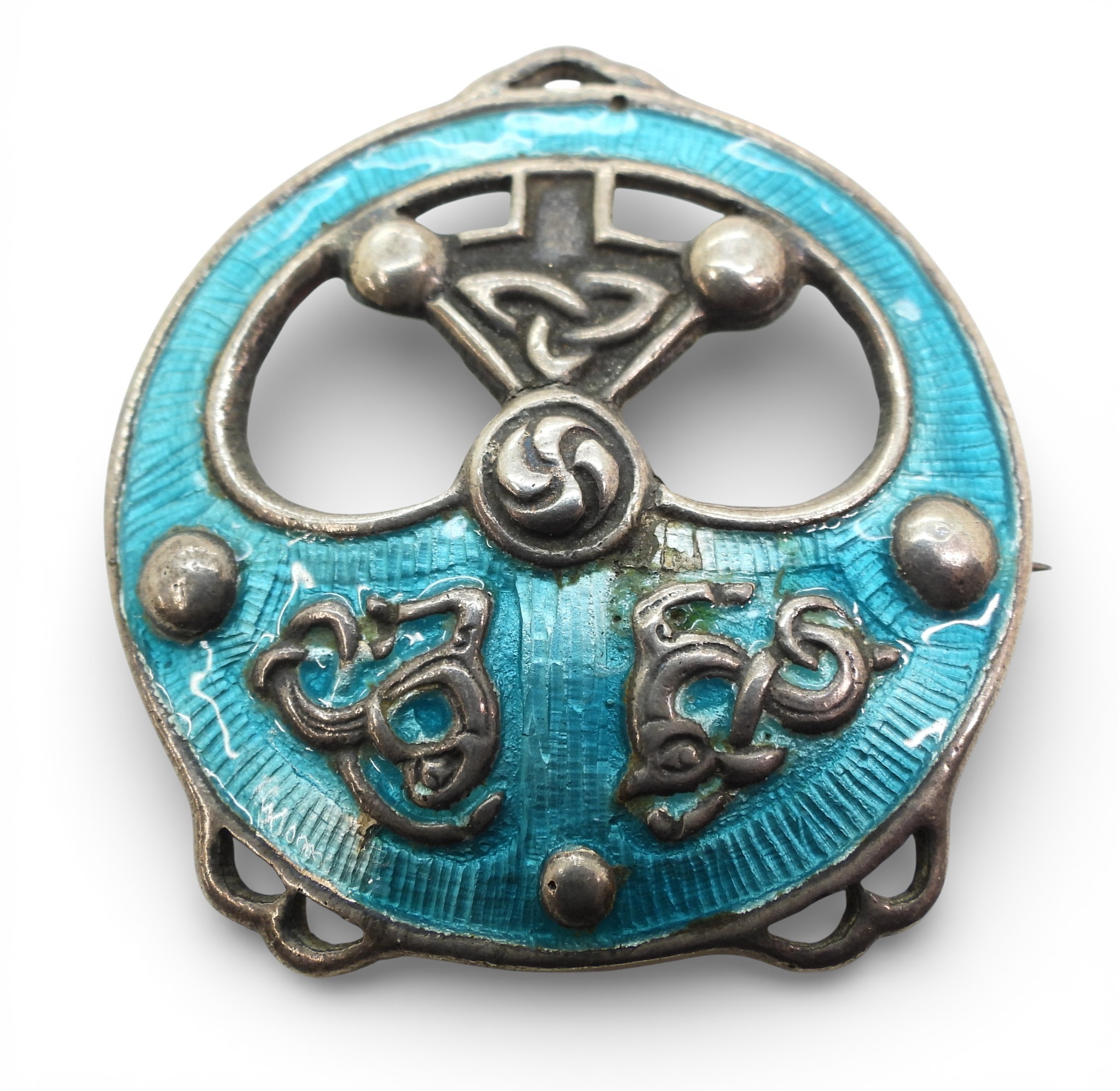 A silver Alexander Ritchie enamelled brooch with zoomorphic design and ...