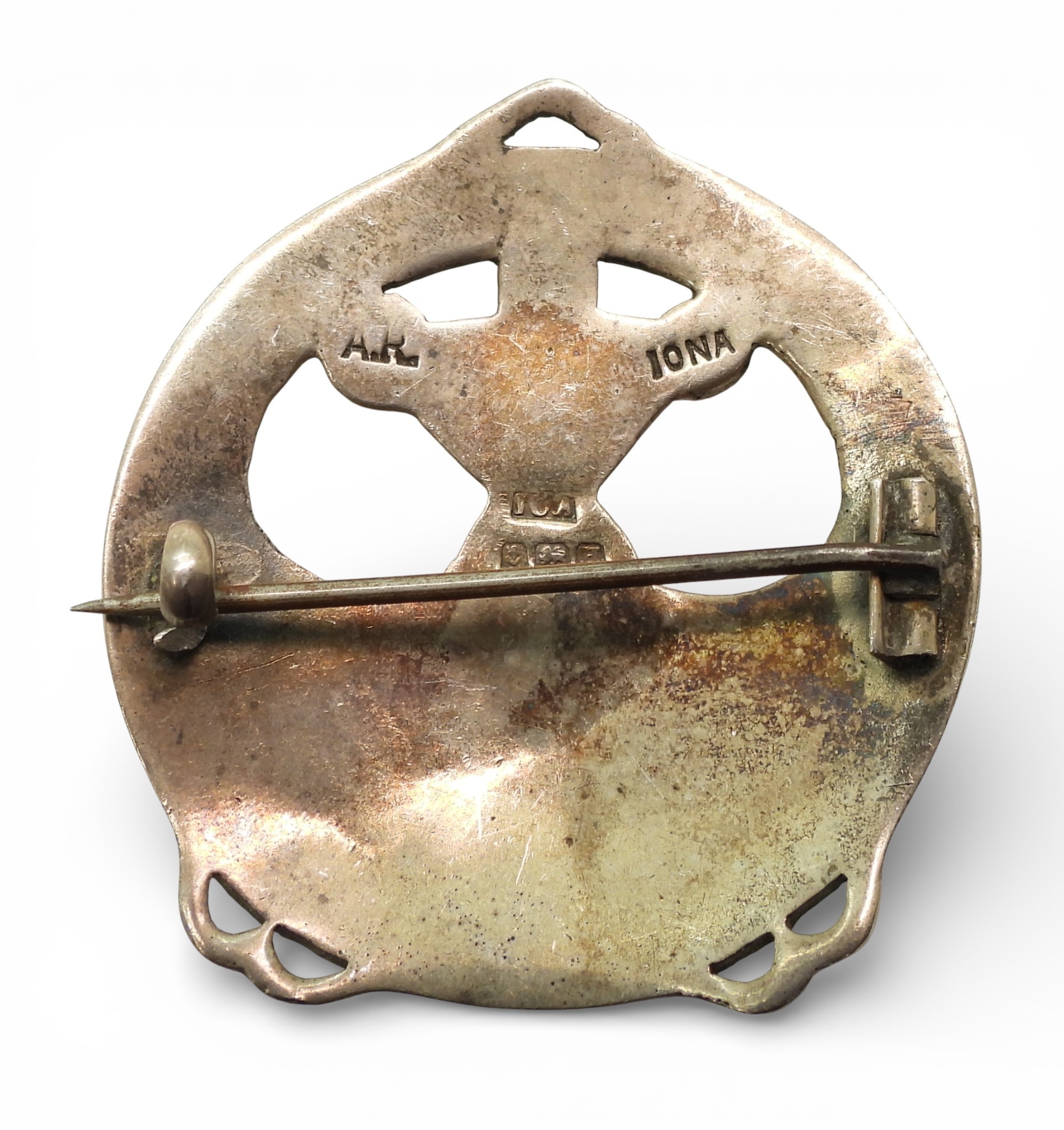 A silver Alexander Ritchie enamelled brooch with zoomorphic design and ...